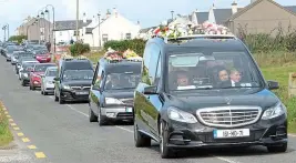  ??  ?? Journey: The procession goes to Cross Cemetary in Belmullet