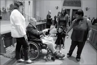  ?? MARK BURNS/OFFCE OF GEORGE H.W. BUSH/POOL VIA AP ?? FORMER PRESIDENT GEORGE H. W. BUSH GREETS MOURNERS with his daughter Dorothy “Doro” Bush Koch during the visitation for former first lady Barbara Bush at St. Martin’s Episcopal Church on Friday in Houston. Barbara Bush died Tuesday at the age of 92.