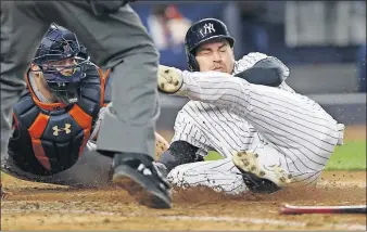  ?? [KATHY WILLENS/THE ASSOCIATED PRESS] ?? Houston Astros catcher Brian McCann, left, tags out the New York Yankees’ Jacoby Ellsbury at the plate for the final out Thursday in New York.
RED SOX 4, BREWERS 1: