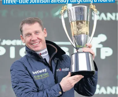  ??  ?? Richard Johnson with the 2017-18 Champion Jockey trophy during at Sundown Park