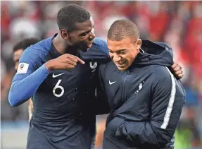  ?? FRANCK FIFE/AFP/GETTY IMAGES ?? Paul Pogba (6) and Kylian Mbappe are stars on a French squad in which 78.3 percent of its players come from a migrant background.
