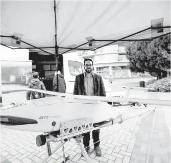  ??  ?? Eldad Alber, operations manager with UVic’s Centre for Aerospace Research, displays his team’s multi-purpose aircraft.