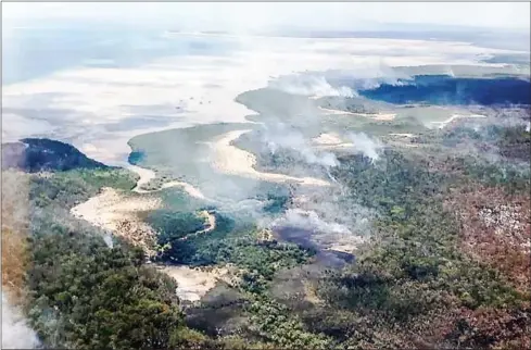  ?? AFP ?? The fire on the world’s largest sand island, off Australia’s east coast, destroyed large swathes of the isle’s forests before heavy downpours arrived over the weekend.