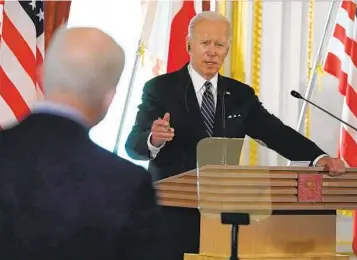  ?? EVAN VUCCI AP ?? President Joe Biden speaks during a news conference with Japanese Prime Minister Fumio Kishida on Monday in Tokyo. Biden later unveiled a 13-nation Indo-Pacific Economic Framework as a counter to China.