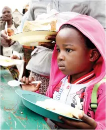  ??  ?? TRAGIC: A child queues for food at a temporary refugee camp for foreign nationals, east of Johannesbu­rg, South Africa, on Monday. (AP)