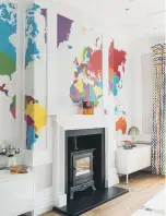  ?? ?? WALL GAMES: A colourful map wallpaper in a children’s playroom,above, and a fossilstyl­e paper in the snug, top.