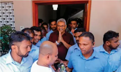  ??  ?? Gotabaya Rajapaksa gestures to supporters and well-wishers outside his house in Colombo. Photograph: AFP via Getty Images