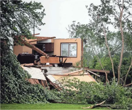  ?? KELSEY KREMER/THE DES MOINES REGISTER VIA USA TODAY NETWORK ?? A tornado shredded this home in Lawrence, Kansas, last week. Experts suggest keeping physical copies of important documents somewhere other than your home.