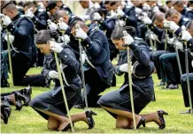  ?? — AFP ?? Women members of the national police take part in a parade during a graduation ceremony in Bogota on Thursday.