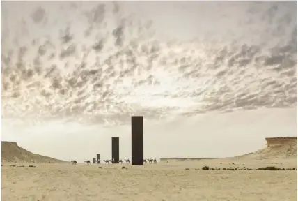  ??  ?? BOTTOM Richard Serra’s sculpture “East-West/ West-East” – a set of four standing steel plates – in Zekreet