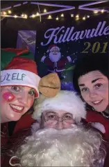  ??  ?? Santa with his helper elf and Marie Cremin