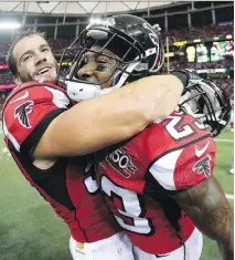  ?? JOHN BAZEMORE/THE ASSOCIATED PRESS ?? The Falcons’ Nate Stupar, left, embraces teammate Robert Alford after Alford’s game-winning touchdown against Washington last week.