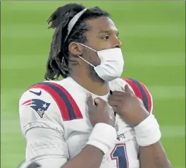  ?? GETTY IMAGES ?? Patriots quarterbac­k Cam Newton looks on during Thursday night’s loss to the Rams.