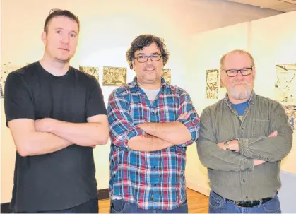  ?? SALLY COLE/THE GUARDIAN ?? Robert Doan, left, Greg Webster and Sandy Carruthers are showing the artwork from their first graphic novel in a new exhibition at The Guild this month. Entitled Sandstone Comics: A 2019 Retrospect­ive, the show runs until Jan. 21.