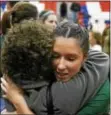  ?? TAMI KNOPSNYDER — FOR DIGITAL FIRST MEDIA ?? Bishop Shanahan’s Renee Shultz hugs a family member after the Eagles’ loss to North Allegheny Saturday at Richland High School.