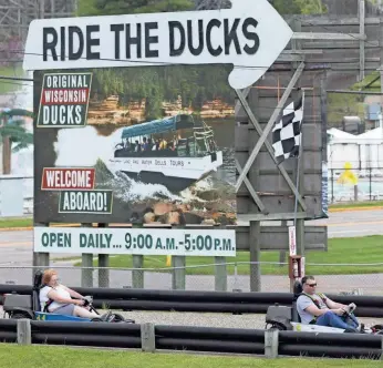  ?? MARK HOFFMAN / MILWAUKEE JOURNAL SENTINEL ?? A pair of adults drive go-karts Thursday at Adare Go Carts in Wisconsin Dells. Water and amusement parks in the Dells are gearing up to reopen after the state Supreme Court overturned Gov. Tony Evers’ safer-at-home order.