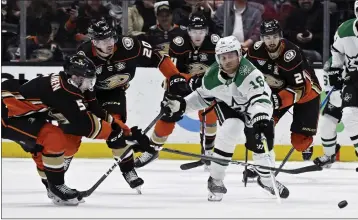  ?? ALEX GALLARDO — THE ASSOCIATED PRESS ?? Dallas Stars center Joe Pavelski (16) pokes the puck away from Ducks defenseman Urho Vaakanaine­n on Friday night.