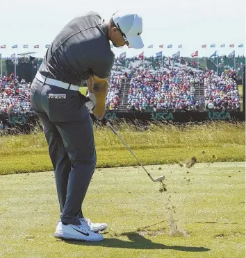  ??  ?? RARE BREED: Cameron Champ, shown hitting from the ninth tee yesterday at Erin Hills, was one of 14 amateurs to start this year’s U.S. Open. After the 36-hole cut, only he and Scottie Scheffler remain.