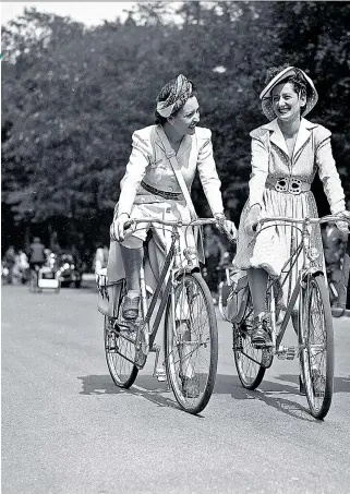  ??  ?? Above: fashionabl­e Parisian cyclists in June 1942. Top right: outside Schiaparel­li. Right: a miniature opera scene by Christian Berard of the Théâtre de la Mode, with couture costumes and real jewels