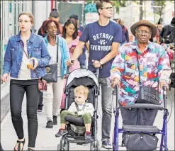  ??  ?? The multicultu­ral mosaic: Diversity on display as people walk along West 125th Street near Malcolm X Boulevard in Harlem on Tuesday.