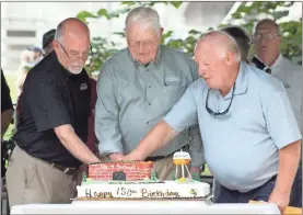  ?? Jeremy stewart ?? Past Rockmart Mayors Steve Miller (from left) and Curtis Lewis join current Mayor Sherman Ross in cutting the official cake for the city’s 150th anniversar­y on Saturday, Aug. 20, 2022, in Seaborn Jones Park.