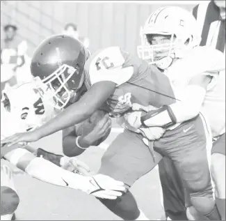  ?? Fred Conley • Times-Herald ?? A Forrest City Mustang back is caught from behind by a Palestine-Wheatley defender during the preseason scrimmage game played Aug. 20 at Sam Smith Stadium. P-W is 0-2 to start the season while the Mustangs are 0-1.