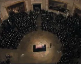  ?? THE ASSOCIATED PRESS ?? The United States begins its formal farewell to the 41st president, George H.W. Bush, with a service at the U.S. Capitol after the casket carrying his remains arrived Monday afternoon.