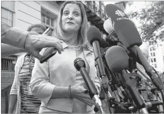  ?? CP PHOTO ?? Canada’s Foreign Affairs Minister Chrystia Freeland speaks to the media as she arrives for trade talks at the Office of the United States Trade Representa­tive, Thursday, in Washington.