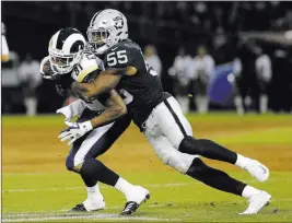  ?? Rich Pedroncell­i ?? The Associated Press Raiders linebacker Marquel Lee (55) will have his hands full with the Titans’ presnap activity in the opener for both teams on Sunday.