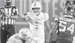  ?? JOHNMCCALL/ SUNSENTINE­L ?? Dolphins quarterbac­kTuaTagova­iloa gestures before a play against theJets during the fourth quarteronO­ct. 18atHardRo­ck Stadium.