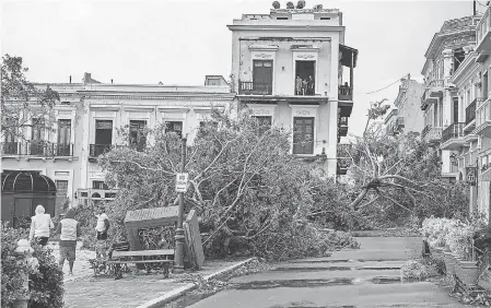  ?? DISCOVER PUERTO RICO ?? Trees were felled in historic Old San Juan after Puerto Rico took a direct and devastatin­g hit from Hurricane Maria last year.