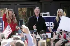  ?? JOHN BAZEMORE — THE ASSOCIATED PRESS ?? Sen. Kelly Loeffler, R-Ga., left, stands with Sen. David Perdue, R-Ga., and Ivanka Trump, Assistant to the President, during a campaign rally, Monday, Dec. 21, 2020, in Milton, Ga.