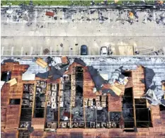  ?? AGENCE FRANCE PRESSE ?? An aerial view of roof damage after a rare confirmed tornado touched down and ripped up building roofs in a Los Angeles suburb in Montebello, California.