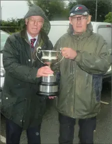  ??  ?? Val Wynne President of Dundalk Salmon Anglers Associatio­n, presenting David Crawley with the Glyde Cup.