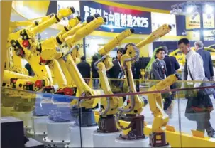  ?? GAO ERQIANG / CHINA DAILY ?? Companies that have used robots say they help boost product quality, which in turn helps the organizati­on become more competitiv­e.