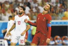  ?? Juan Barreto / AFP / Getty Images ?? Portugal star Cristiano Ronaldo reacts after a missed shot. He also missed a penalty kick, his sixth miss in his past 14 tries.