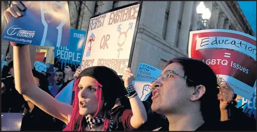  ?? Photograph: AP Photo/Andrew Harnik ?? Activists and protesters rally in front of the White House over plans to overturn school guidance on protecting transgende­r students