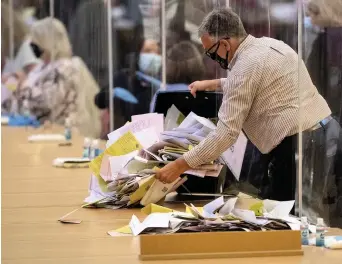  ?? Picture: Ashley Crowden ?? Ballot papers are emptied onto the table during the Swansea West count.