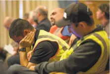  ?? Santiago Mejia / Special to The Chronicle ?? Members of the group Carpenters in Action attend the Board of Supervisor­s meeting in a show of support of the project.