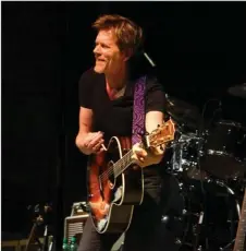  ?? The Sentinel-Record/File photo ?? PARADE DAY: Actor Kevin Bacon performs as part of The Bacon Brothers following the First Ever 13th Annual World’s Shortest St. Patrick’s Day Parade on March 17, 2016. Parade organizers are concerned that rain may dampen this year’s concert.