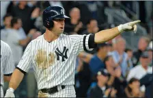  ?? HOWARD SIMMONS/TRIBUNE NEWS SERVICE ?? The Yankees' Brett Gardner celebrates after scoring a run against the Astros in Game 5 of the American League Championsh­ip Series in New York on Wednesday.