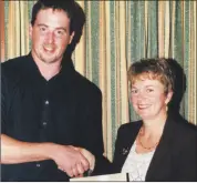  ?? ?? Eleanor Prendergas­t accepting a cheque for €2,000 from PJ O’Donoghue, chairman Kilworth and Araglin Point-to-Point committee. The money proceeds of a race night held during the carnival in 2002, was to go towards the hospital’s cancer care unit.