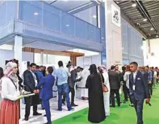  ?? Abdul Rahman/Gulf News ?? Visitors register for the Bridges project at Aldar pavilion during the Cityscape Abu Dhabi yesterday.