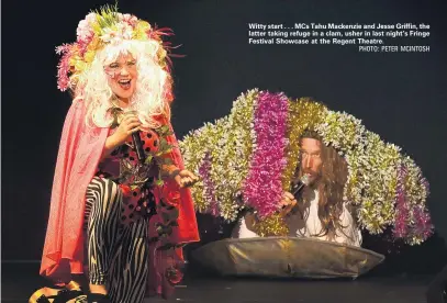  ?? PHOTO: PETER MCINTOSH ?? Witty start . . . MCs Tahu Mackenzie and Jesse Griffin, the latter taking refuge in a clam, usher in last night’s Fringe Festival Showcase at the Regent Theatre.