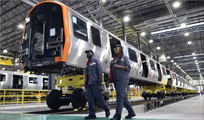  ?? CHRISTOPHE­R EVANS — BOSTON HERALD ?? Gov. Maura Healey says her administra­tion will have an in-person presence at CRRC’s Springfiel­d factory, where Orange and Red Line train cars are being assembled.