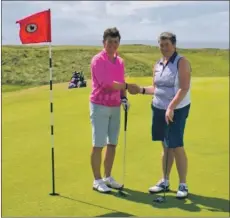  ??  ?? Ailie MacBrayne, left, congratula­tes her playing partner Ann Gallacher on winning the Colin Chrystie Quaich.