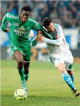  ?? — AP ?? Saint-Etienne defender Kurt Zouma (left) staves off a challenge from Marseille forward Andre-Pierre Gignac during their Ligue 1 match in Marseille, France, on Sunday. Marseille won 1-0.