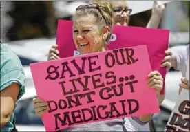  ?? RICK BOWMER / ASSOCIATED PRESS ?? While Republican­s have become more lukewarm on their party’s efforts, Democrats are more fiercely defending the Affordable Care Act. Here protesters rail against the Senate’s health care bill in Salt Lake City in June.