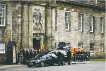  ?? ?? The coffin of Queen Elizabeth II arrives at Holyroodho­use in Edinburgh, Scotland. It will remain in Scotland until it is transporte­d to London ahead of the funeral Sept. 19.
