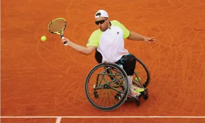  ?? Photograph: Julian Finney/Getty Images ?? Dylan Alcott plays a forehand against Andy Lapthorne in the French Open final at Roland Garros.